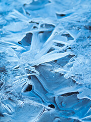 Texture of ice - close-up of ice texture in shades of blue, soft light