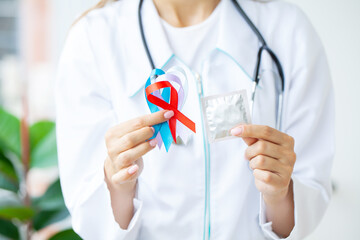 Doctor holds colored ribbons symbolize awareness of various diseases