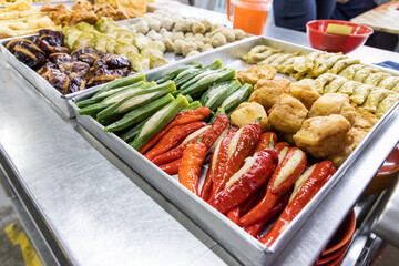 Yong tau foo, delicious fried stuffed fish paste into chilli pepper, okra, aubergine, bean paste and other varieties.