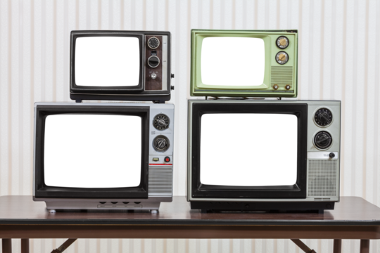 Four vintage televisions on table with cut out screens.