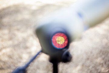 Close-up shot of an archery target face through a spotting scope