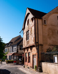 View of ancient half-timbered residential houses in old town of Provins on sunny summer day, France..