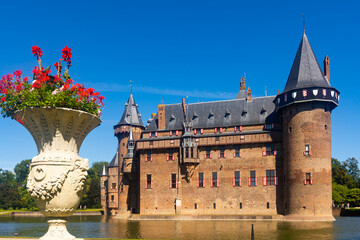 Dutch castle surrounded by moat, De Haar Castle, located in Utrecht, Netherlands.