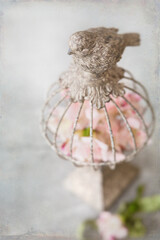 Metal Bird Cage Decor with Bird and Pink Flower Petals