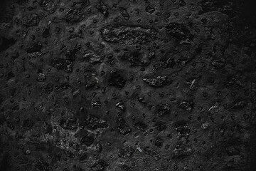 Fototapeta na wymiar Black texture. Stone background. Dark marble. Rock texture. Rock surface with cracks. Rock pile. Paint spots wall. Grunge Rough structure. Abstract texture.