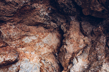 Brown texture. Stone background. Rock texture. Grunge Rough structure. Abstract texture. Rock surface with cracks. Rock pile. Paint spots wall. Wall marble.