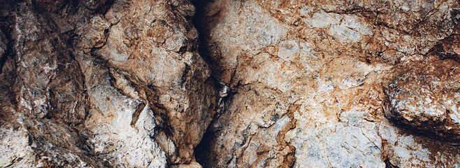 Brown texture. Stone background. Rock texture. Grunge Rough structure. Abstract texture. Rock surface with cracks. Rock pile. Paint spots wall. Wall marble.