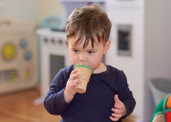 cute toddler pretending to eat icecream