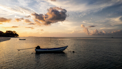 Boat silhouette at sunrise