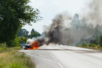 car burning in the road