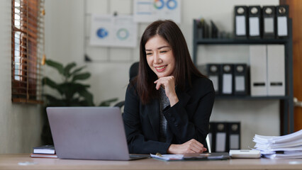 Beautiful asian businesswoman working in office. business finance concept