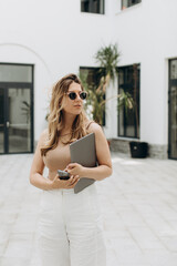 Work Time in Startup - Casual Young Woman Walking and Working In The Minimalist Office Terrace