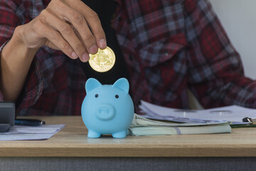 Hand holding bitcoin,man worker trade crypto and save coin for future,selective focus.