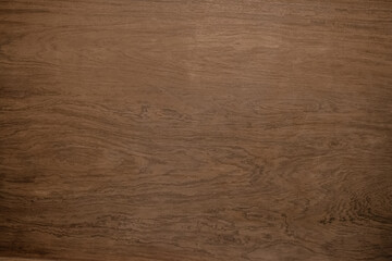 Dark wood texture background surface with old natural pattern walnut texture. Brown wood grain surface nature rustic for seamless. Board wooden plywood pine, top table for design and decoration.