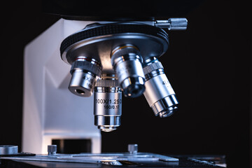 professional scientific equipment microscope for medicine scientist using in biotechnology science laboratory, biology or chemistry and medical technology research with microbiology experiment