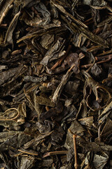 Big dry leaves of sencha tea, close up shot for a shop