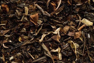 Granulated dry green tea with herbs and flowers, aesthetic photography