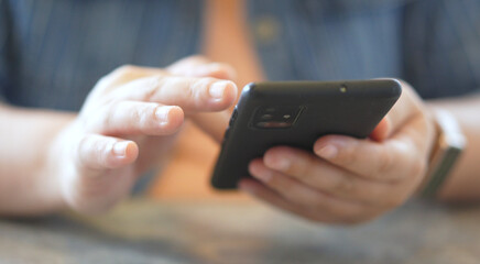 Woman hands using smartphone