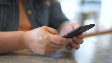 Woman hands using smartphone