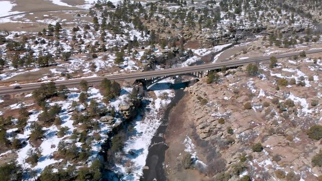 Cars Driving Over Bridge at Castlewood Canyon in Colorado Mountains • Descending Aerial Drone Shot • Horizontal HD Footage