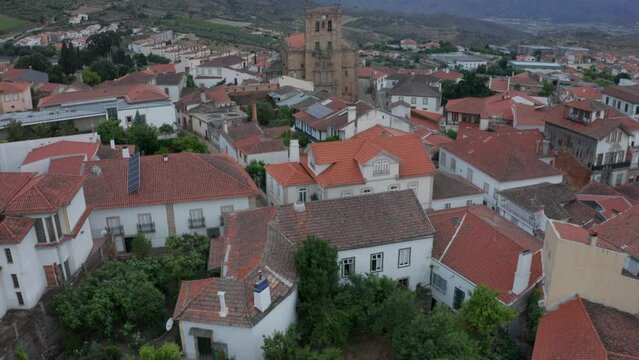 Fly Over Old Town With The Imposing Our Lady Of The Assumption Parish Church In Torre de Moncorvo, Braganca, Portugal. Aerial Drone