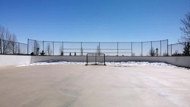 Outdoor Hockey Rink with Snow • Skating Rink in Park • Aerial Drone Shot • Horizontal HD Footage