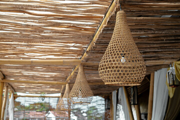 Lamp cover decoration made from bamboo, wood or rattan with blurred background