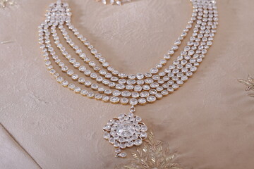 Round stone diamond necklace with a diamond dollar