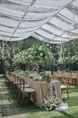 Ornamental decorations with multi flora. Outdoors light. Wedding ceremony or wedding decoration with clear tent in the sunny afternoon natural lights.