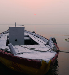 indian fishing boat in ganges river in varanasi gaht in india