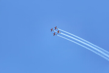 Modern airplanes flying in blue sky
