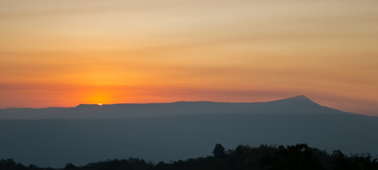 The morning of sunshine behind the Khao Yai national park mountain  in the winter of Thailand. Asia sunrise view