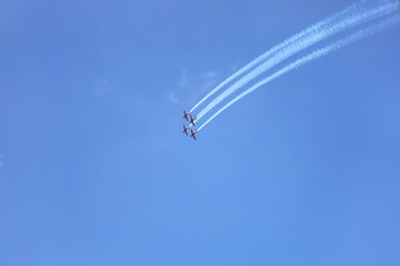 Modern airplanes flying in blue sky
