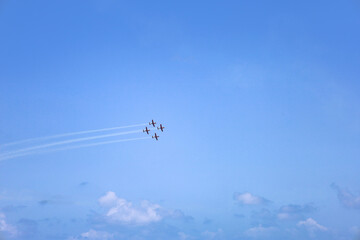 Modern airplanes flying in blue sky