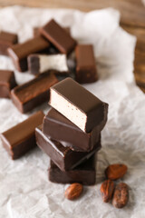 Stack of tasty bird's milk candies on table