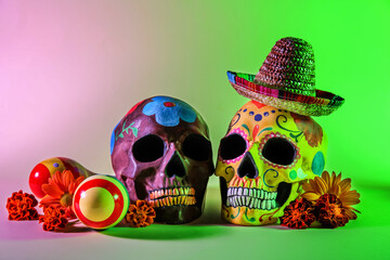 Painted skulls for Mexico's Day of the Dead (El Dia de Muertos), sombrero hat, maracas and flowers...