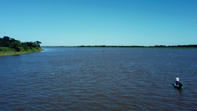 Small fishermans boat fishing in the Paraguay river.