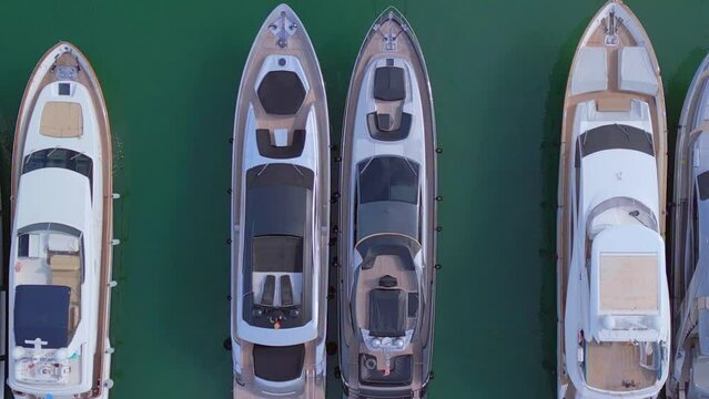 expensive new luxury yachts.
Stunning aerial view flight vertical 9:16 bird's eye view zoom out drone
at ibiza town port October 2022. 4k marnitz cinematic