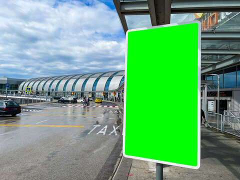 Airport Terminal Exterior Outside View With Green Screen Chroma Key Digital Display Targeting Information And Advertising At Passengers And Commuters Going On Holiday And Vacations Via Airline Flights