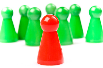 green plastic counters, one red as leader or standing out