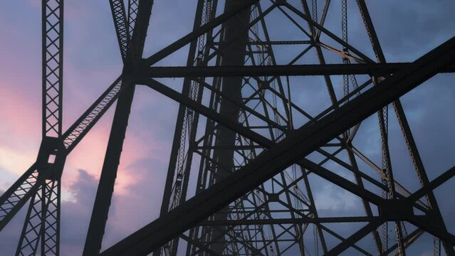 Highrise steel railway bridge at sunset. Slow motion. 