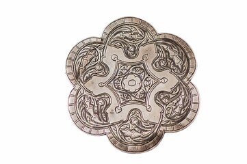 Artistic flower shape coin with beautiful engravings on a white background