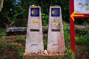 Two monoliths that indicate different places to follow the Camino de Santiago. Photography made in...