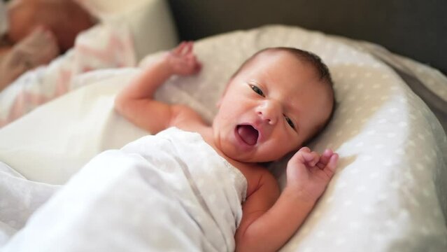 baby newborn. little baby a newborn 1 month of life lies in bed in the maternity hospital. happy family kid dream concept. close-up baby indoors. beautiful cute girl lies at home lifestyle