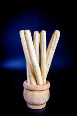 Breadsticks on dark background