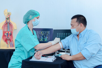 The doctor placed a tourniquet on his arm. in order to inject the patient