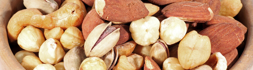 mixed nuts in a wooden bowl