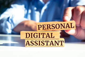 Wooden blocks with words 'Personal Digital Assistant'. Business concept.