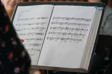 woman learning to read musical notes