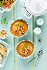 Vegetarian autumn pumpkin and carrot soup with chickpeas and quinoa. Comfort food, autumn-winter...